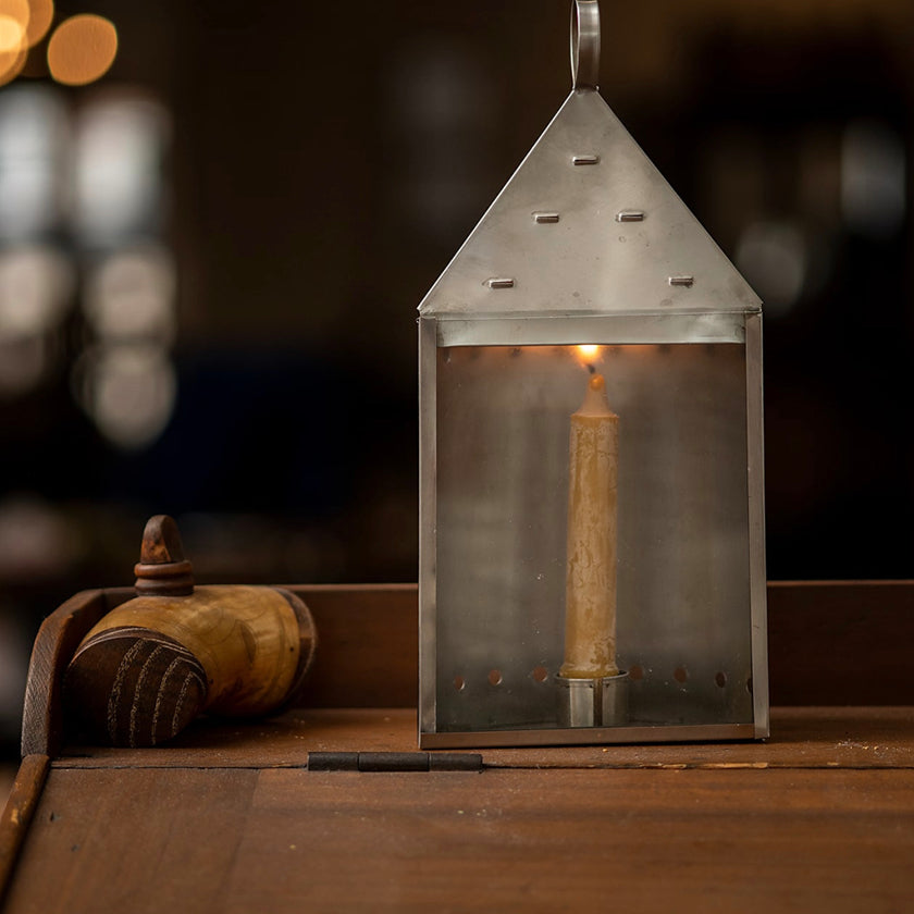 18th Century Home and Camping Accessories from Samson Historical. Pictured is a lantern with a beeswax candle.