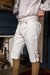 Man adjusting Early American White Cotton Breeches