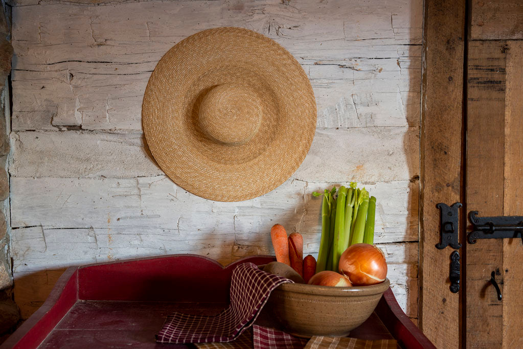 Straw Hat hanging in Colonial American Home