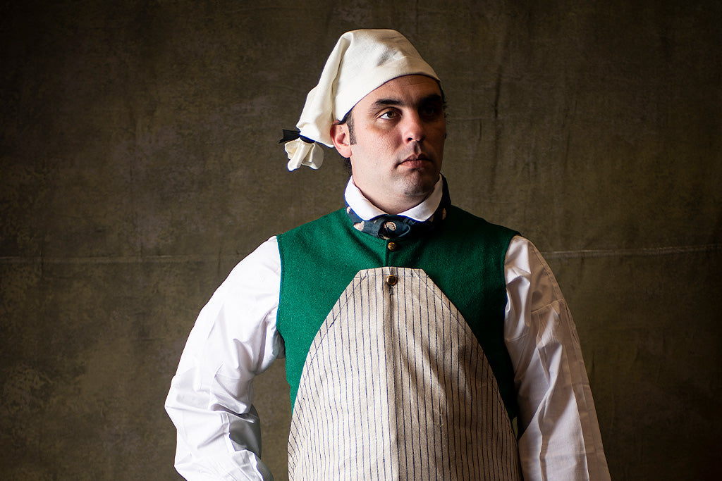 18th Century Tradesman wearing a Linen Workmans Cap